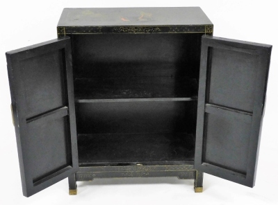 A Chinese black lacquer two door cabinet, decorated with figures, flowering branches, etc., with brass hinges, on brass capped feet, 66cm high, 59cm wide, 28cm deep. - 7