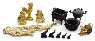 A collection of Oriental metalware, to include a pair of brass temple dog figures, dragon, various three bronze finish vessels, elephant weights, etc. (a quantity)