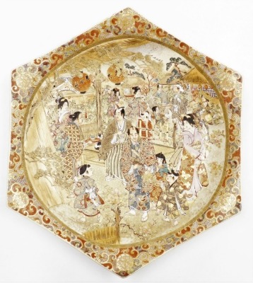 A Japanese earthenware hexagonal shaped plaque, decorated with numerous figures in a village scene, unmarked, 36cm wide, and a Japanese Meiji period earthenware plaque, with similar decoration (AF), 32cm diameter. - 5