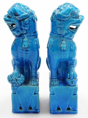 A pair of 20thC Chinese porcelain dogs of fo, each glazed in blue, 20cm high, stamped Made in China to underside. - 2