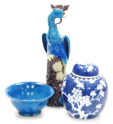 A 20thC Chinese porcelain figure of a phoenix, in turquoise glaze with purple plumage on a purple and white glaze leaf and floral base, 30cm high (AF), a Chinese turquoise glaze bowl on circular foot, 13cm diameter (AF), and a Chinese ginger jar and cover
