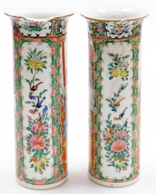 A pair of Cantonese famille rose porcelain vases, with flared rims, decorated with reserves of figures, flowers, birds, etc., 30cm high (AF), and a 19thC pottery figure of a dog of fo, 11cm high. (AF) - 5