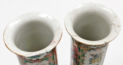 A pair of Cantonese famille rose porcelain vases, with flared rims, decorated with reserves of figures, flowers, birds, etc., 30cm high (AF), and a 19thC pottery figure of a dog of fo, 11cm high. (AF) - 6