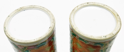 A pair of Cantonese famille rose porcelain vases, with flared rims, decorated with reserves of figures, flowers, birds, etc., 30cm high (AF), and a 19thC pottery figure of a dog of fo, 11cm high. (AF) - 7