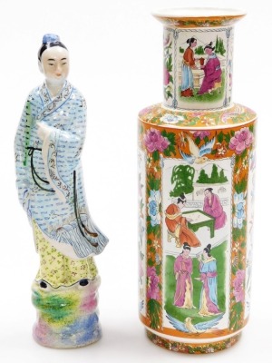 An Oriental porcelain vase, of cylindrical shouldered form, decorated with repeat reserves of figures, flowers, butterflies, etc., 33cm high, and a pottery figure of a deity, 32cm high. (2)