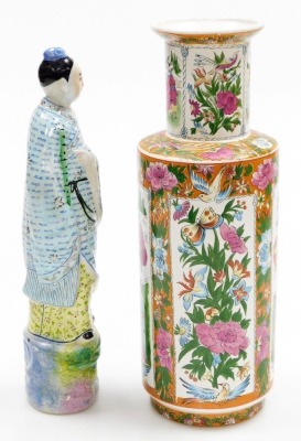 An Oriental porcelain vase, of cylindrical shouldered form, decorated with repeat reserves of figures, flowers, butterflies, etc., 33cm high, and a pottery figure of a deity, 32cm high. (2) - 4