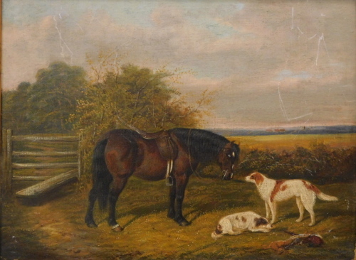 19thC English School. Horse and dogs in a paddock with houses in the distance, oil on canvas, unsigned, probably by the same hand as lot 1072, 30cm x 39cm.