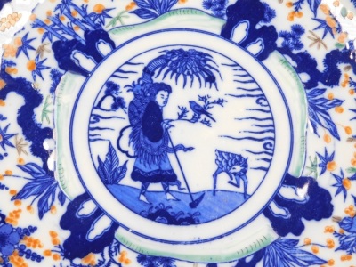 A Meiji period Imari charger, transfer printed in blue and enamelled in colours with a farmer, animal and bird, within a border of The Three Friends (pine prunus and bamboo), three character mark to underside, 36.5cm diameter. - 2