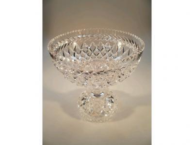 A large two sectional cut glass punch bowl with circular base
