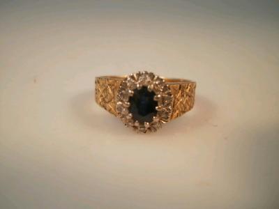 A c1960's tiny diamond and sapphire cluster dress ring