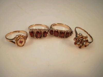 Four dermantoid garnet set dress rings including a Victorian signet ring (4)