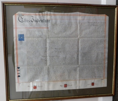 An indenture, dated 1875, for Sarah Ann Townsend and Elizabeth French, glazed and framed, 72cm x 85cm and a further Indenture. (2) - 3