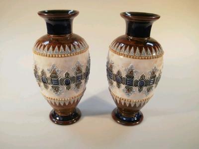 A pair of Doulton Lambeth baluster vases