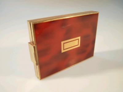 A mid 20thC rectangular metal ladies boudoir compact cigarette case