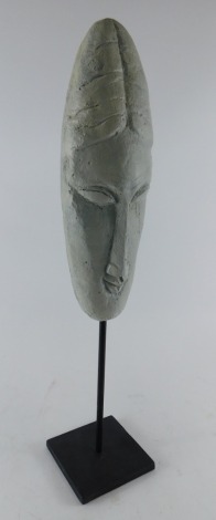 Manner of Modiglini. Facial sculpture on stand, unsigned, late 20thC, 59cm high.