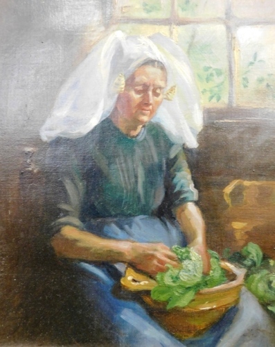 S. Drayton (19thC School). A Dutch Vrouw, lady in a parlour peeling vegetables, oil on canvas, attributed to the frame and handwritten label verso, 27cm x 23cm