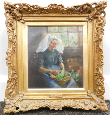 S. Drayton (19thC School). A Dutch Vrouw, lady in a parlour peeling vegetables, oil on canvas, attributed to the frame and handwritten label verso, 27cm x 23cm - 2