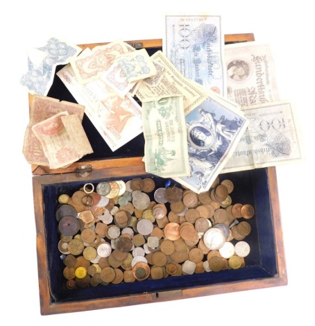 Various world coins and banknotes, some GB, William IV and later, contained in a heavily carved box, probably sandalwood, 38cm wide. (a quantity)