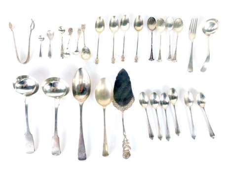 Various Georgian and later silver flatware, a ladle, fiddle pattern, 16cm long, another similar, Lincoln Imp topped spoons, various other flatware, etc., 15oz, and some silver plated ware. (a quantity, various dates and makers)