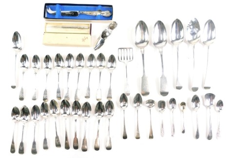 Various silver flatware, a George IV dessert spoon, old English pattern, monogrammed, London 1822, 20cm long, and various other silver flatware, teaspoons, varying designs, various assays, shoe ornament, etc., 22oz, and a small quantity of silver plated w