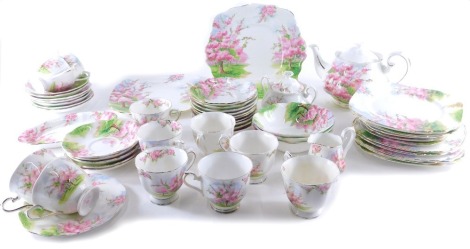 A Royal Albert Blossom Time part service, to include teapot, 15cm high, serving plates, side plates, lidded sugar bowl, milk jug, cups, saucers, etc., printed marks beneath. (a quantity)