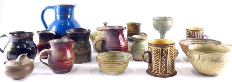 Various studio pottery and related effects, a jug with beak spout and plain handle in blue glazes, 23cm high, another ribbed jug in red, etc. (a quantity)