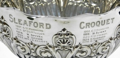 An Edward VII silver presentation bowl, The Sleaford Croquet Club Lincolnshire Championship Challenge bowl, of semi fluted form, embossed with foliate scrolls and shell motifs, engraved with an armorial and the winners from 1907-1932, Atkin Brothers, Shef - 2