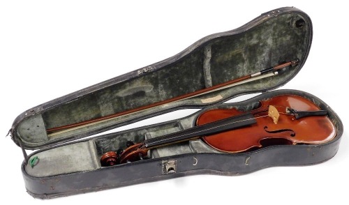 A Pierre Silvestre a Lyon violin, with a two piece back, tuning knobs with gold plated tips, bears label, dated 1857, with a bow, in a W E Hill & Sons of New Bond Street London case.