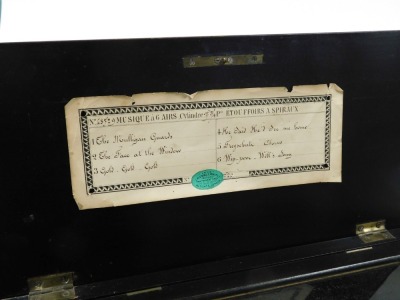 A late 19thC Swiss musical box, playing six airs, in an ebonised case, 42cm wide. - 4