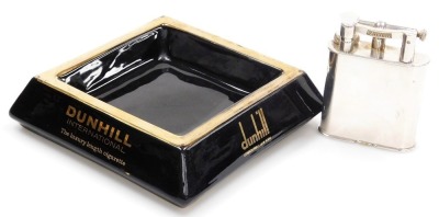 A Dunhill silver plated giant table lighter, patent number 390107, registered design number 737418, of plain form, 10.5cm high, and a Dunhill ashtray, (2).