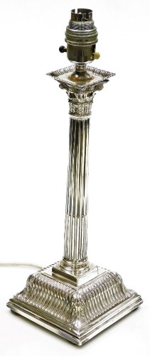 A George II silver Corinthian column candlestick, converted to electricity, on a loaded base, Samuel Smith III, London 1759, 38cm high overall.