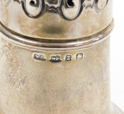 A late Victorian silver sugar sifter, of baluster semi fluted form, with a flame shaped final above a pierced repousse decorated lid, William Davenport Birmingham 1899, 5.47oz, 19cm high. - 2