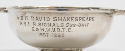 An Elizabeth II Scottish silver quaich, of plain form with presentation inscription 'W. O. II David Shakespeare P. S. I. R. Signals Sub-Unit E & H. W. U. O. T. C. 1967-1969', Edinburgh 1961, 12cm wide, and a silver dish with presentation inscription 'To C - 2