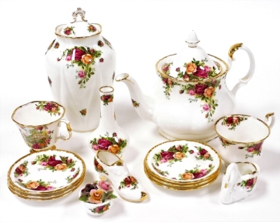 A Royal Albert Old Country Roses porcelain teapot, together with a fluted jar and cover, pair of teacups, six spoon dishes, bud vase, and three ornaments formed as a swan, shoe and bowl of flowers.