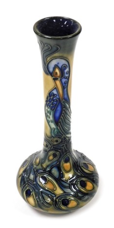 A Moorcroft Pottery vase decorated in the Phoenix pattern, of long necked form, designed by R J Bishop, dated 96, painted and impressed marks, boxed, 20.5cm high.