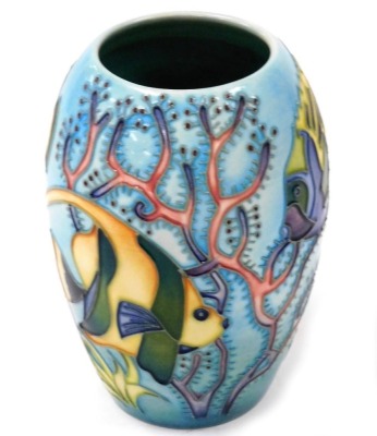 A Moorcroft Pottery vase decorated in the Martinique pattern, signed and dated 97, painted and impressed marks, boxed, 13.5cm high.