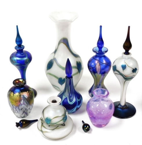 A group of Okra glass scent bottles and stoppers, with stylised leaf and trailing decoration, an Okra vase dated 1989, and a Caithness glass vase. (8) (AF)