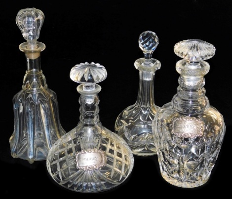 A Victorian cut glass mallet shaped decanter and stopper, globe and shaft decanter and stopper, and two cut glass decanters and stoppers with silver decanter labels for sherry and whisky. (4)