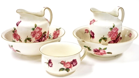 A Minton Pottery wash set decorated in the Tile pattern, with cabbage roses, printed marks, comprising two wash jugs and bowls, and a chamber pot. (5) (AF)