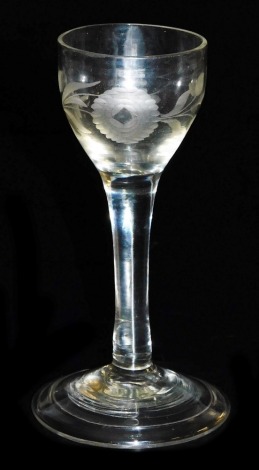 A Georgian wine glass, possibly of Jacobean Rebellion significance, the bowl engraved with floral motifs, raised on a plain stem and conical folded foot, 14cm high.