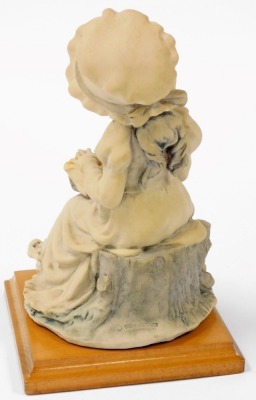 A Guiseppe Armani of Florence figure of a girl, modelled seated holding a basket of chicks, circa 1982, signed, raised on a square wooden base, 23cm high. - 2