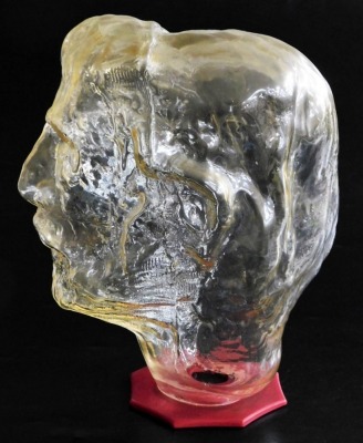 A modernist art glass sculpture of a man's bust, raised on a red Perspex base, 32cm high. - 2