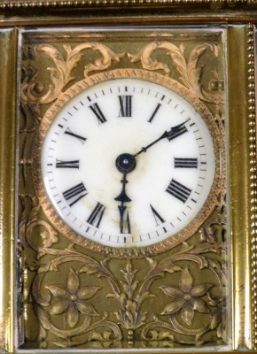 A late 19thC brass cased carriage clock, the circular enamel dial bearing Roman numerals, against a plate worked in relief with flowers and scrolling leaves, single barrel movement, the case of conventional form, with beaded trim, with key, 11cm high. - 2