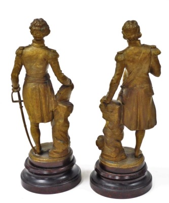 A pair of late 19thC spelter figures of Nelson and Wellington, gold painted, raised on stained wooden socles, with name plates, 44cm high. - 2