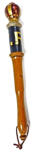 A Victorian turned wooden truncheon, painted with V. R cypher against a blue ground, with a crown knop, 39cm wide.