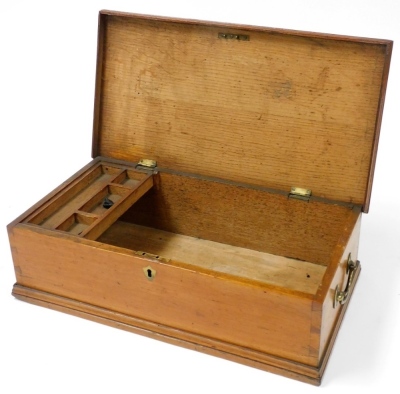 A Victorian oak writing box, of rectangular section, the hinged lid opening to reveal a compartmented tray and vacant interior, with twin brass carrying handles, 14cm high, 47cm wide, 25cm deep. - 2