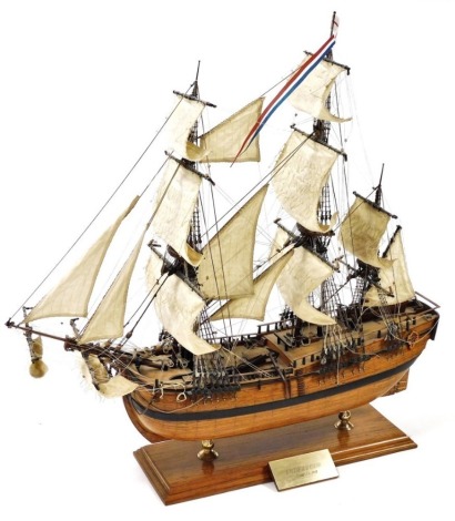 A wooden scale model of the Endeavour, a three masted sailing vessel, raised on a wooden stand with plinth, model number 140, 60cm wide.