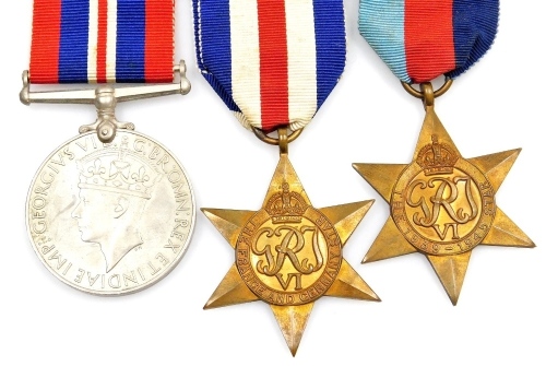 Three World War II medals, a France and Germany Star, a 1939-45 Star, and a 1939-45 War medal, with ribbons. (3)