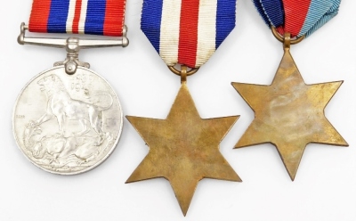 Three World War II medals, a France and Germany Star, a 1939-45 Star, and a 1939-45 War medal, with ribbons. (3) - 2