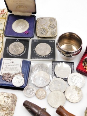 Various bygones and collectables, commemorative crowns, an Earl Mountbatten of Burma token, a 19thC alphabetic sampler (Jane ?), unframed, 27cm x 21cm, corkscrews, pipe, various badges, thimbles, plated napkin ring, etc. (1 tray) - 3